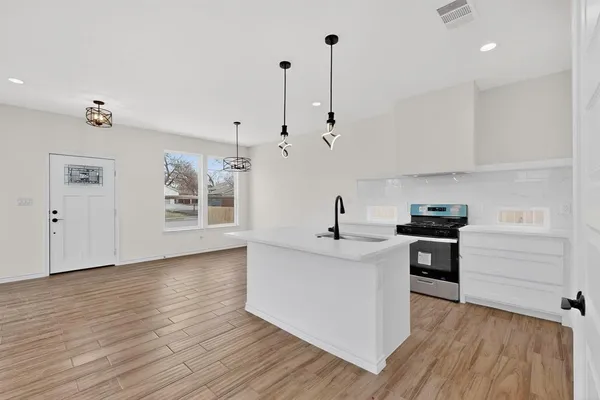 a kitchen with sink and window