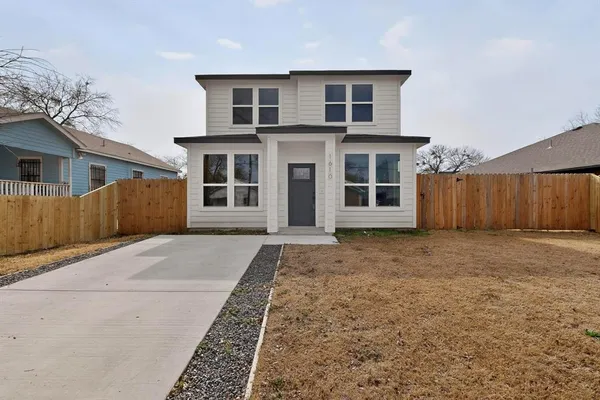 front view of a house with a yard