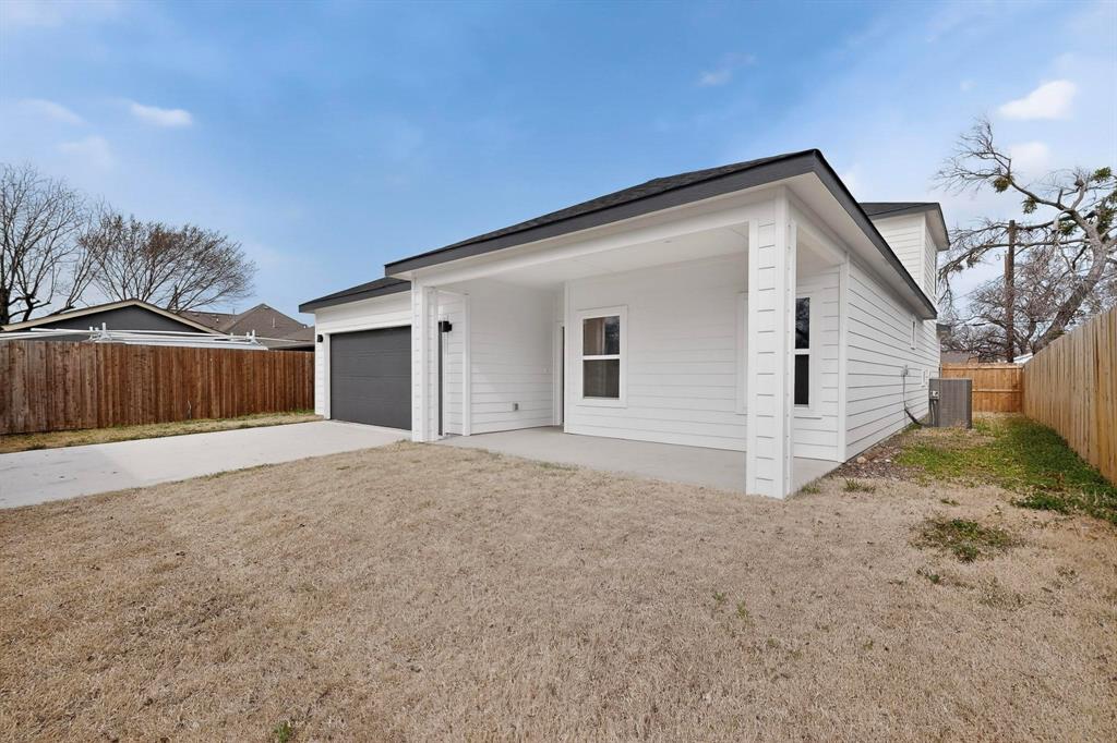 1610 Life Avenue Dallas, TX 75212 - Photo 36 of 38 a view of a house with backyard and trees