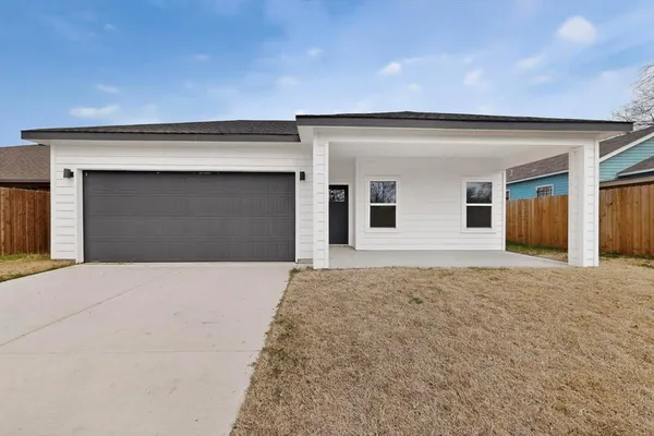 a front view of a house with a garage