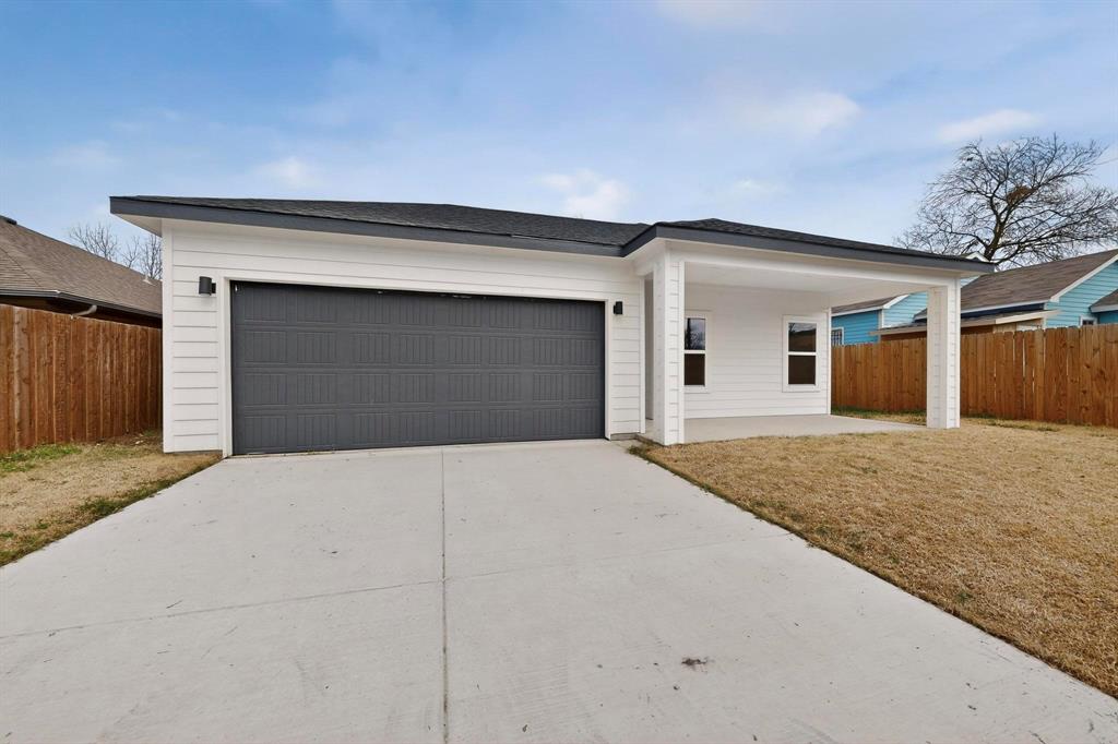 1610 Life Avenue Dallas, TX 75212 - Photo 38 of 38 a front view of a house with a garage