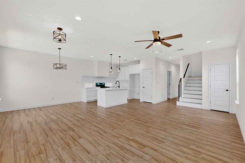 1610 Life Avenue Dallas, TX 75212 - Photo 8 of 38 a view of empty room with wooden floor and ceiling fan