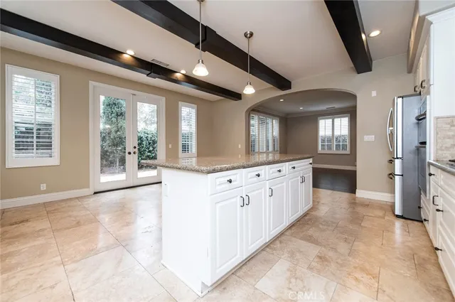 a large en suite bathroom with a large mirror vanity and a shower