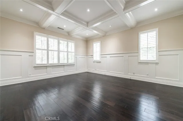 a spacious bathroom with a granite countertop sink and a mirror