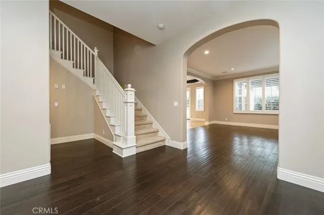 a view of an entryway with wooden floor