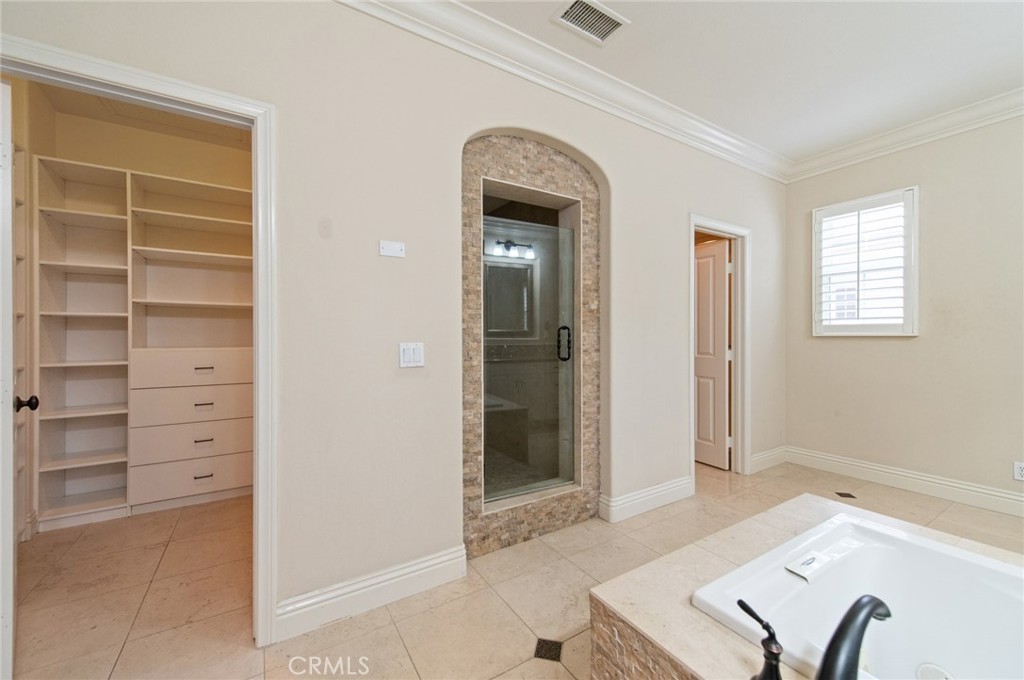 26 Secret Garden Irvine, CA 92620 - Photo 21 of 38 a view of a livingroom with furniture and closet