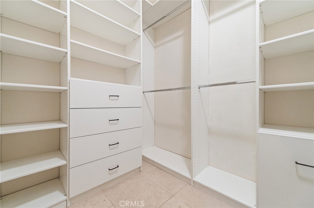 26 Secret Garden Irvine, CA 92620 - Photo 22 of 38 a view of walk in closet
