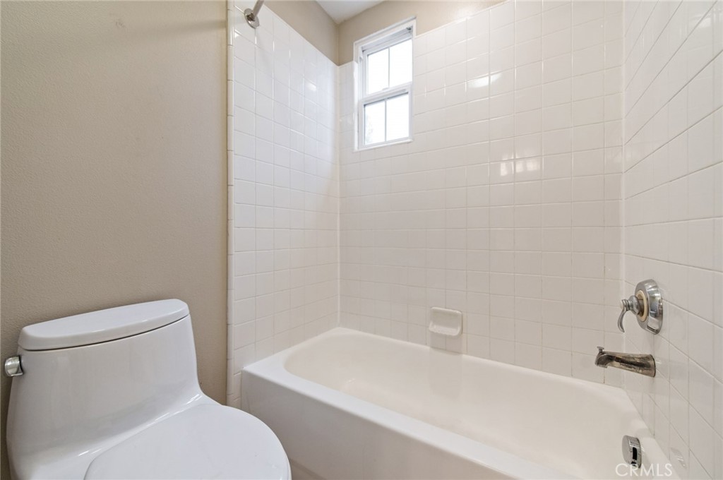 26 Secret Garden Irvine, CA 92620 - Photo 29 of 38 a white toilet sitting next to a bath tub