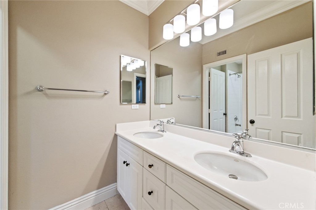 26 Secret Garden Irvine, CA 92620 - Photo 30 of 38 a bathroom with a sink and a mirror