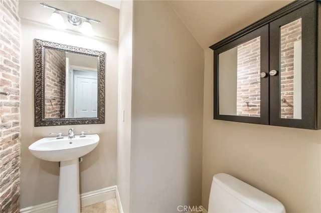 a bathroom with a sink and mirror