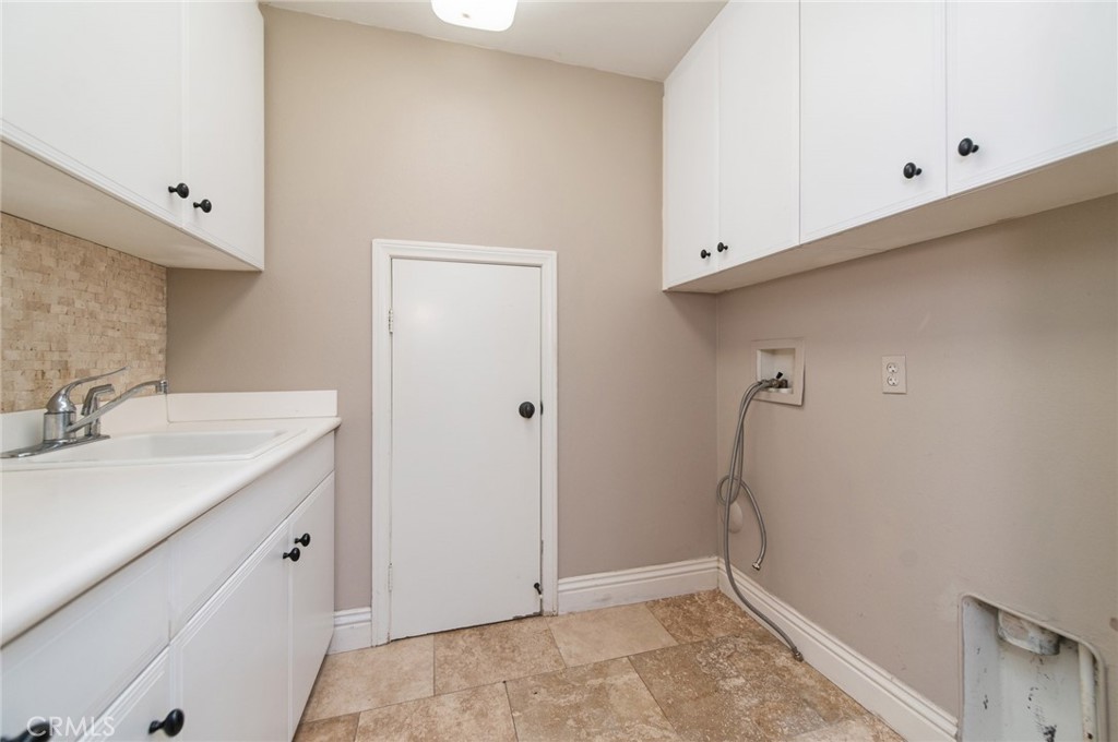 26 Secret Garden Irvine, CA 92620 - Photo 34 of 38 a bathroom with a sink and mirror