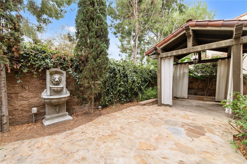 26 Secret Garden Irvine, CA 92620 - Photo 37 of 38 a front view of a house with a yard