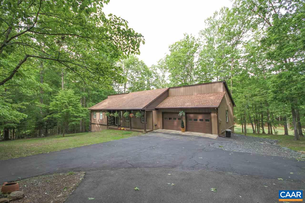 52 Oak Grove Road Palmyra, VA 22963 - Photo 40 of 46 a house with trees in the background