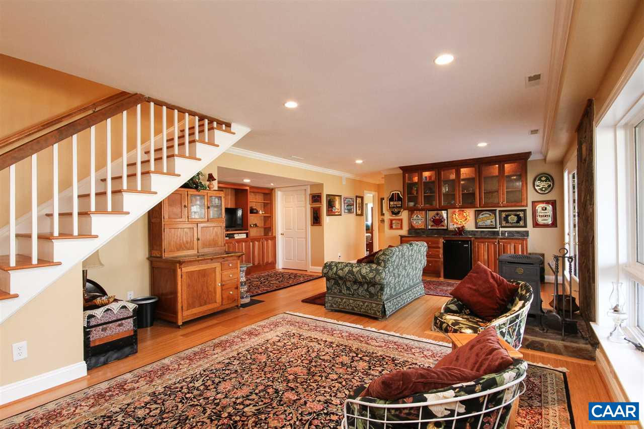 52 Oak Grove Road Palmyra, VA 22963 - Photo 8 of 46 a living room with furniture and a rug