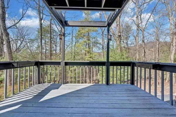 a view of balcony with wooden floor