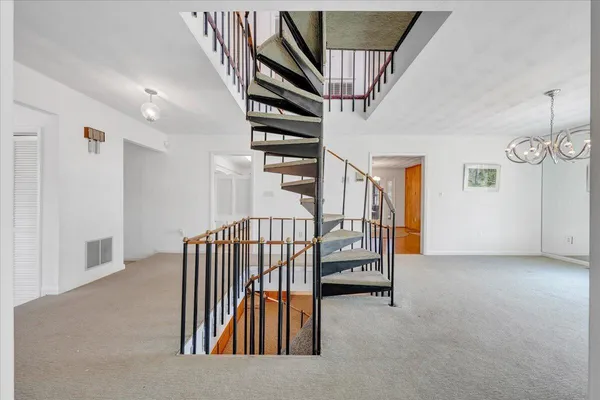 a view of entryway with stairs and a couch