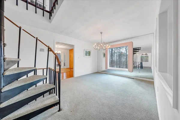 a view of a hallway with staircase