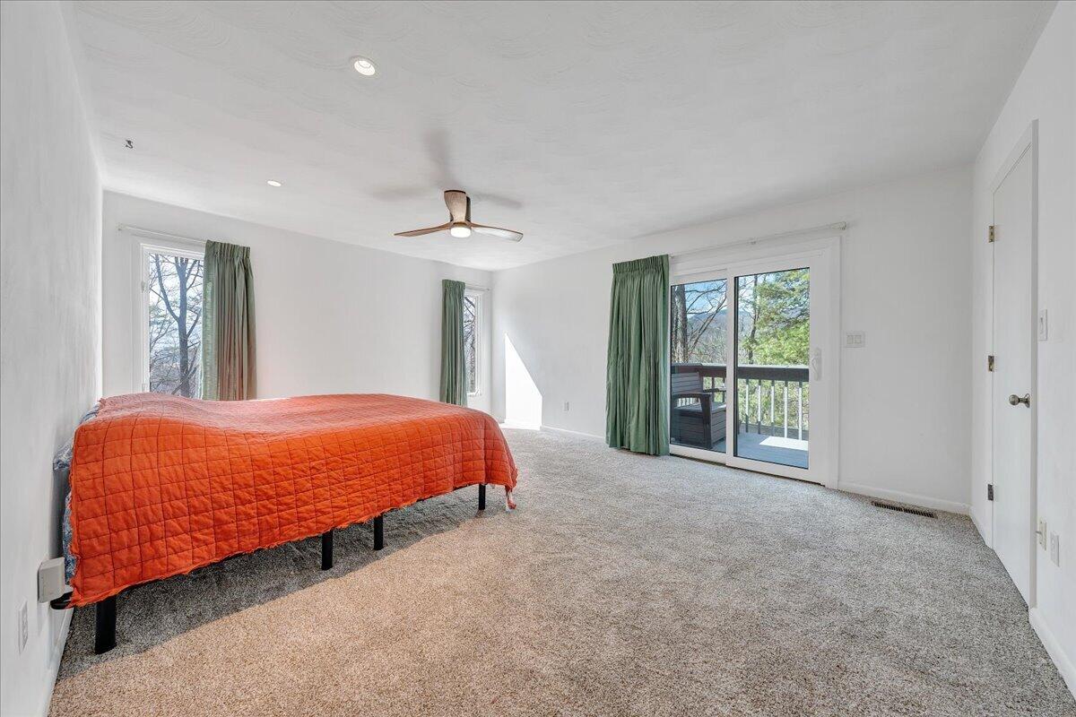 6878 Mt Chestnut Road Roanoke, VA 24018 - Photo 27 of 50 a bed sitting in a spacious bedroom next to a window