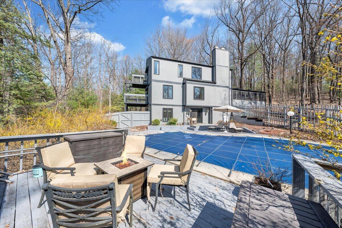6878 Mt Chestnut Road Roanoke, VA 24018 - Photo 3 of 50 a view of a patio with couches table and chairs and wooden floor