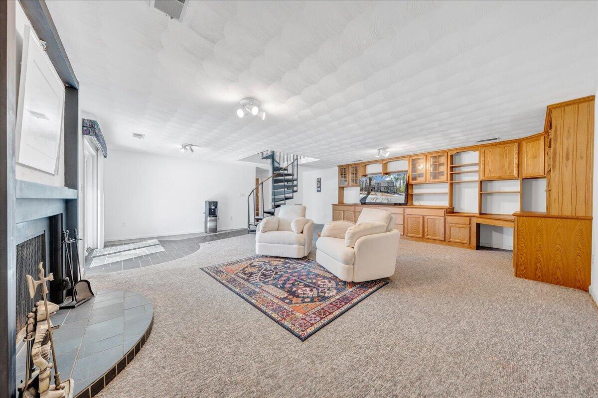 6878 Mt Chestnut Road Roanoke, VA 24018 - Photo 38 of 50 a living room with furniture and a fireplace