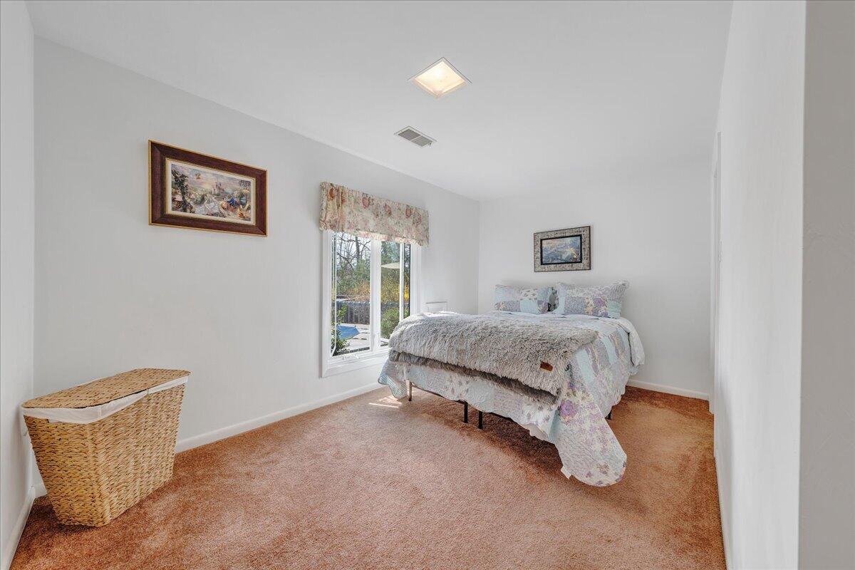 6878 Mt Chestnut Road Roanoke, VA 24018 - Photo 40 of 50 a bedroom with a bed and a couch