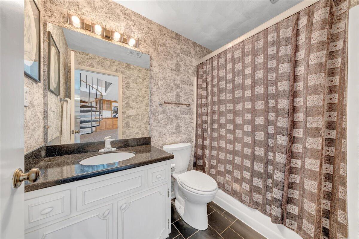 6878 Mt Chestnut Road Roanoke, VA 24018 - Photo 41 of 50 a bathroom with a granite countertop bathtub sink vanity mirror and toilet