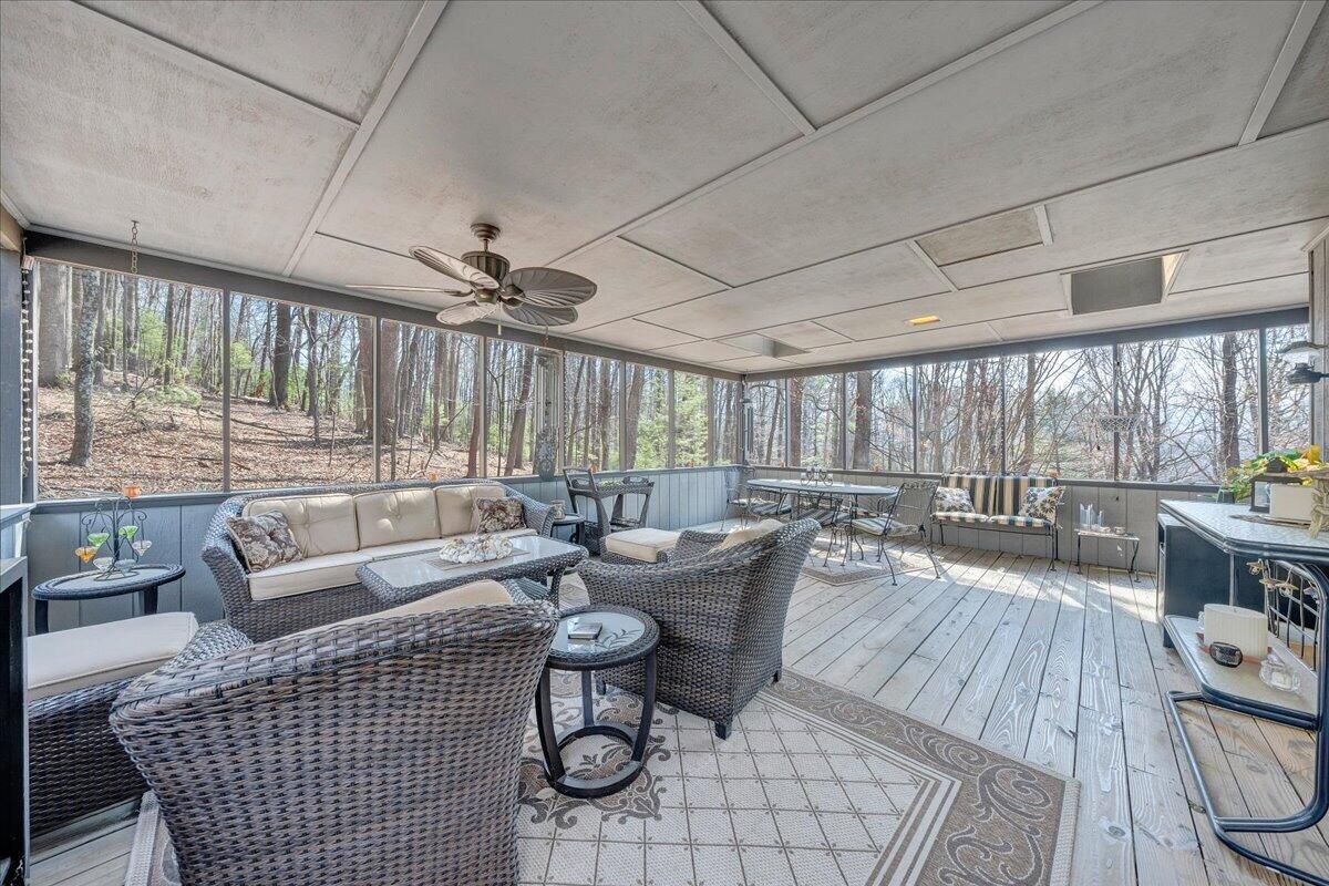 6878 Mt Chestnut Road Roanoke, VA 24018 - Photo 42 of 50 a living room with furniture a large window and wooden floor