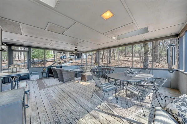 a living room with furniture a table and chairs