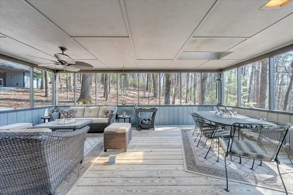 a view of a chairs and table in the balcony