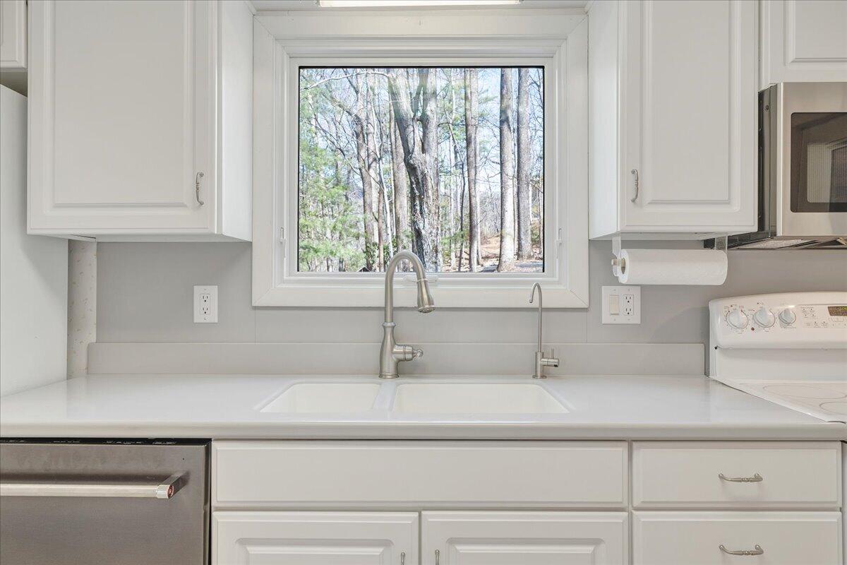 6878 Mt Chestnut Road Roanoke, VA 24018 - Photo 10 of 50 a kitchen with a sink and cabinets