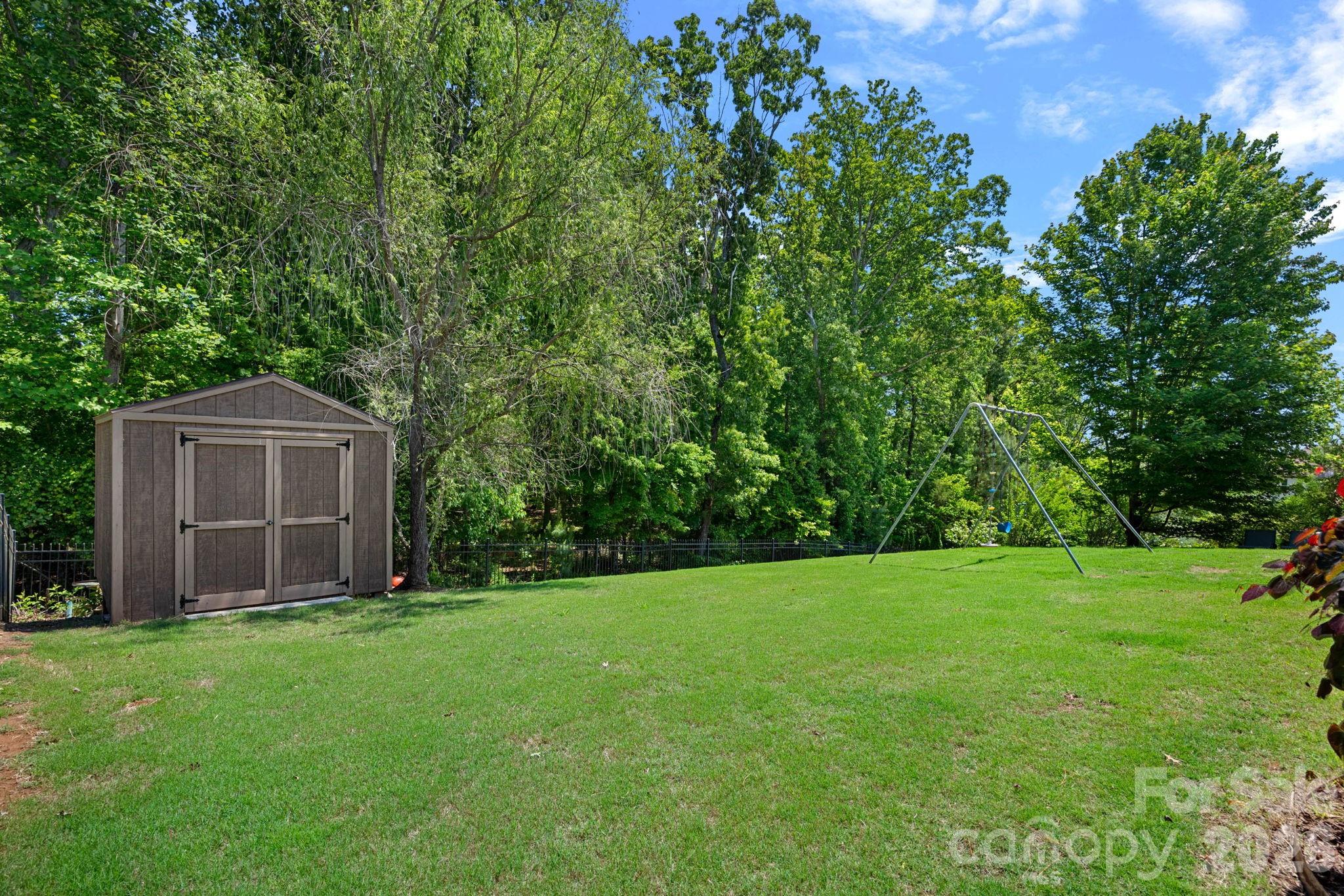 897 Tyne Drive Fort Mill, SC 29715 - Photo 24 of 46 a view of an house with backyard space and garden