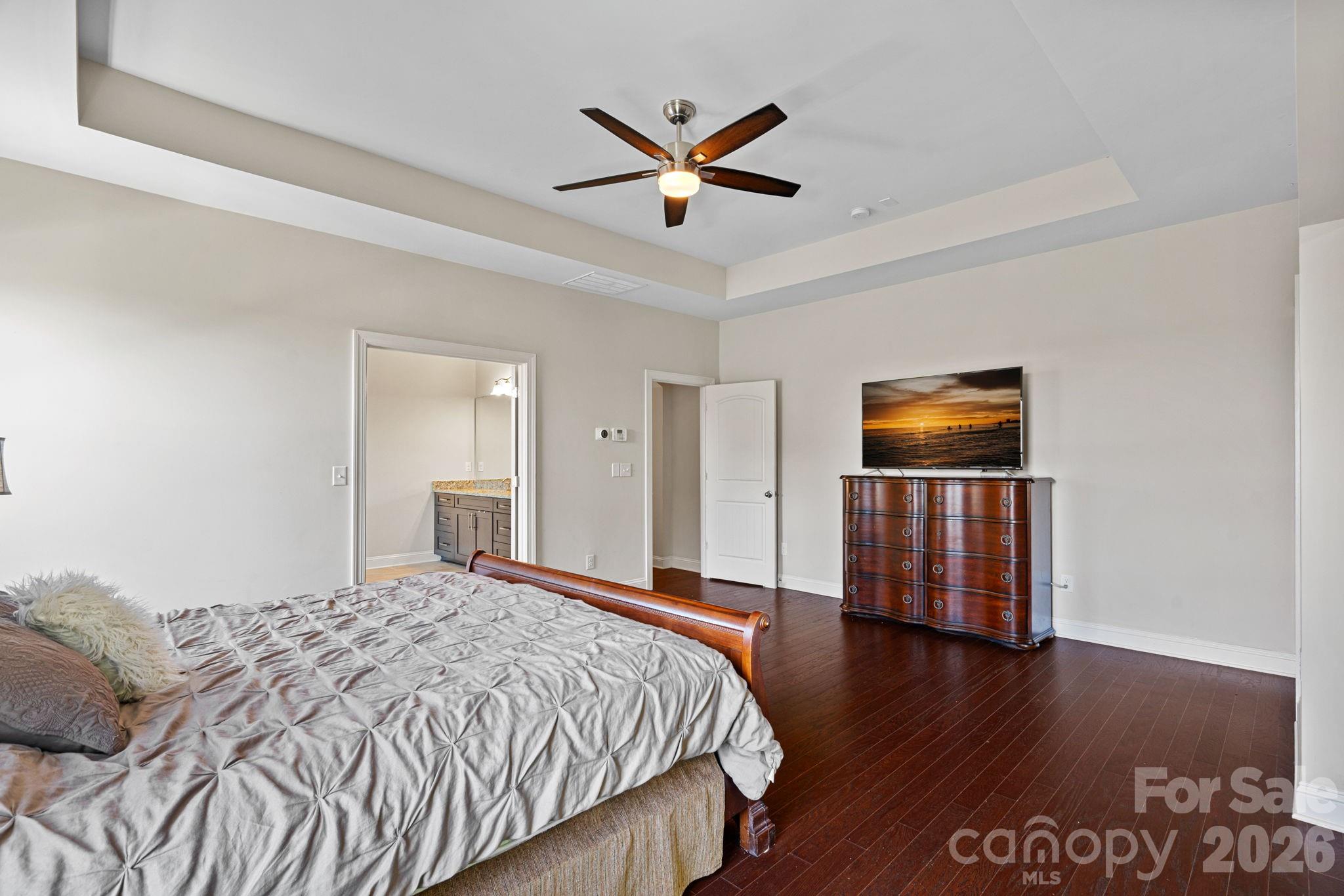 897 Tyne Drive Fort Mill, SC 29715 - Photo 32 of 46 a bedroom with a large bed and a ceiling fan