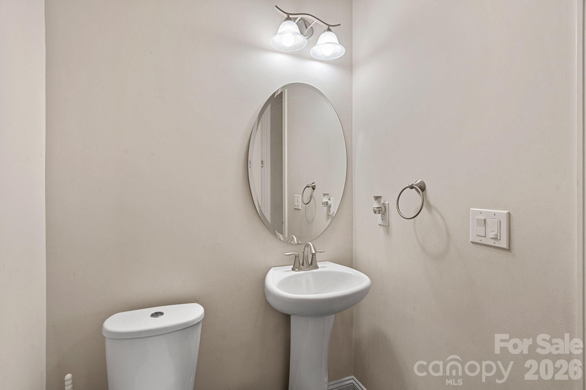 897 Tyne Drive Fort Mill, SC 29715 - Photo 34 of 46 a bathroom with a sink a mirror and a toilet