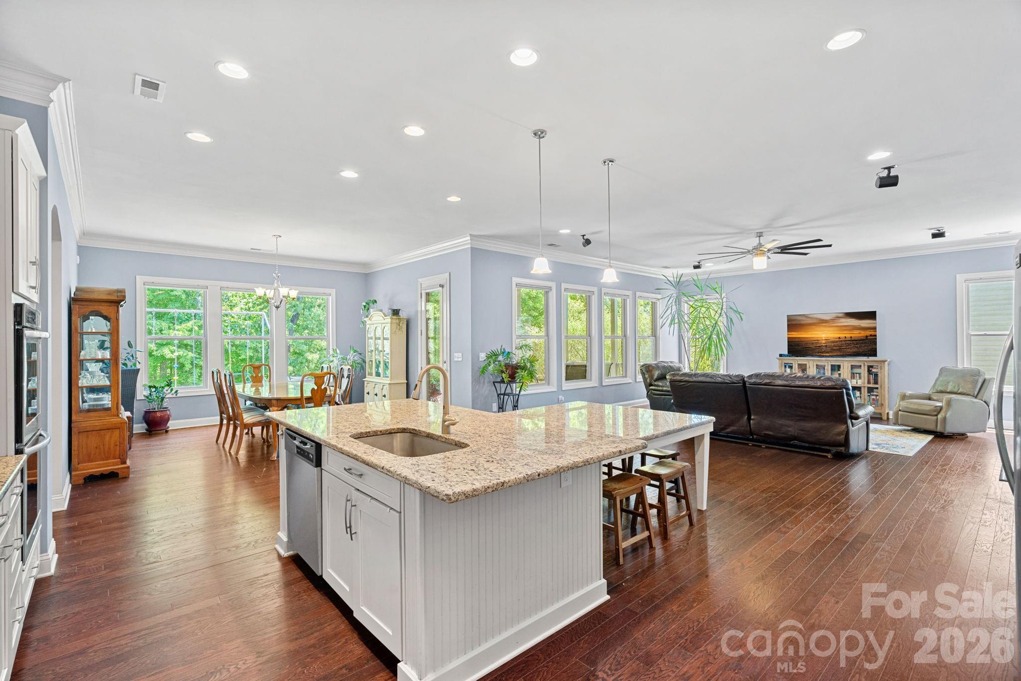 897 Tyne Drive Fort Mill, SC 29715 - Photo 6 of 46 a large kitchen with kitchen island a large center island attached withe living room