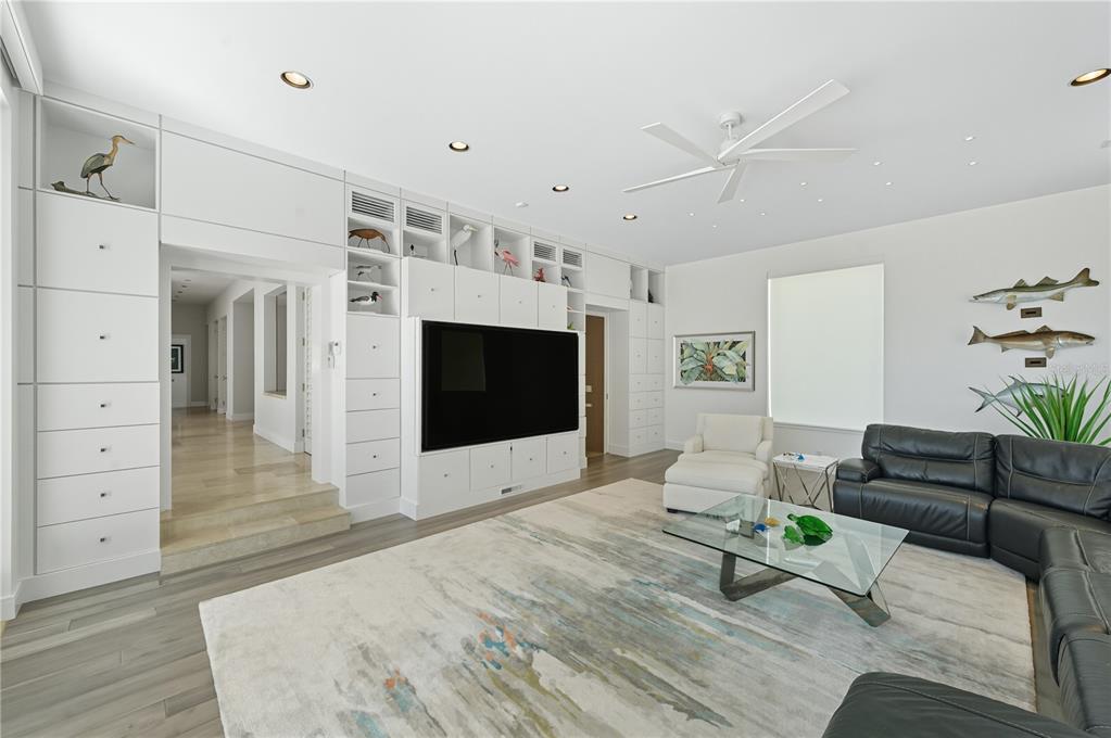 3315 Bay Shore Road Sarasota, FL 34234 - Photo 65 of 96 a living room with furniture and a flat screen tv