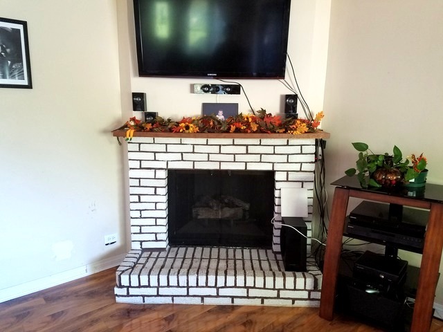723 Town Road West Chicago, IL 60185 - Photo 5 of 17 a living room with furniture and a fireplace