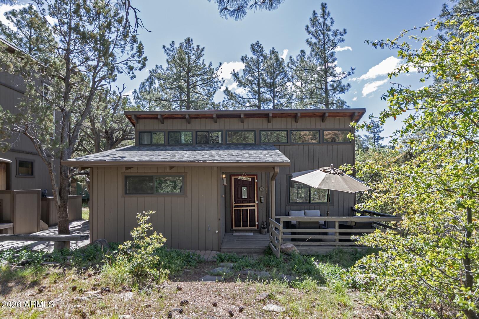 4880 Tor Street Pine, AZ 85544 - Photo 2 of 34 a front view of a house with garden