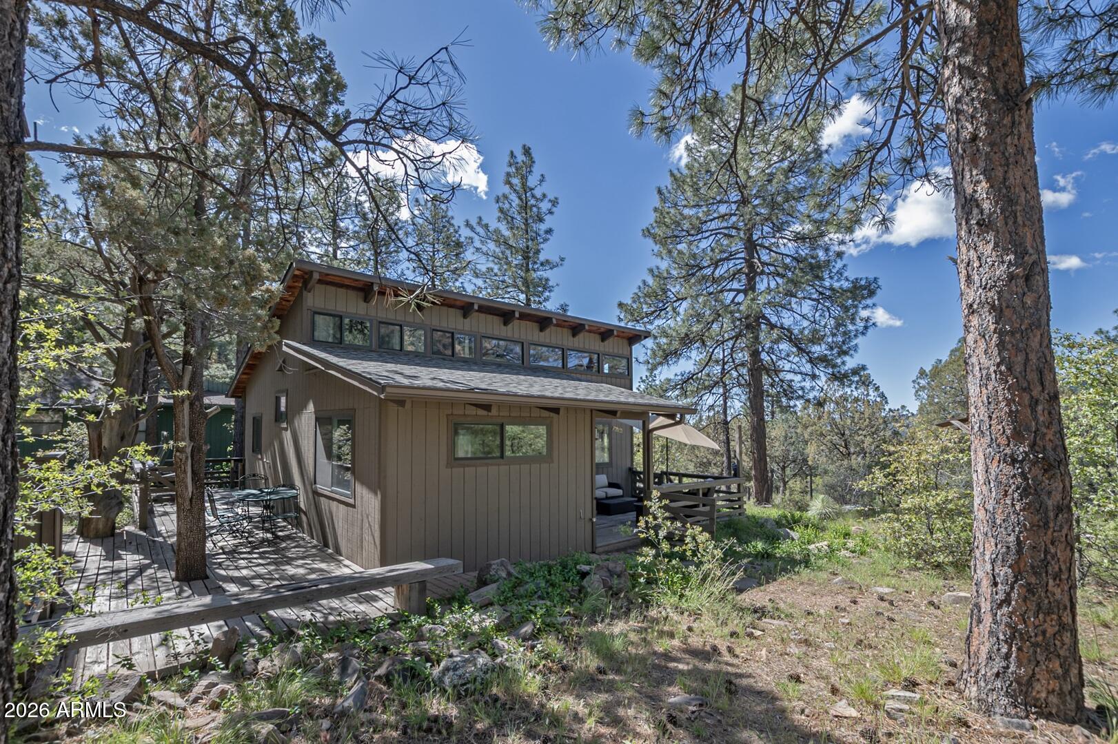 4880 Tor Street Pine, AZ 85544 - Photo 21 of 34 a view of a house with a yard