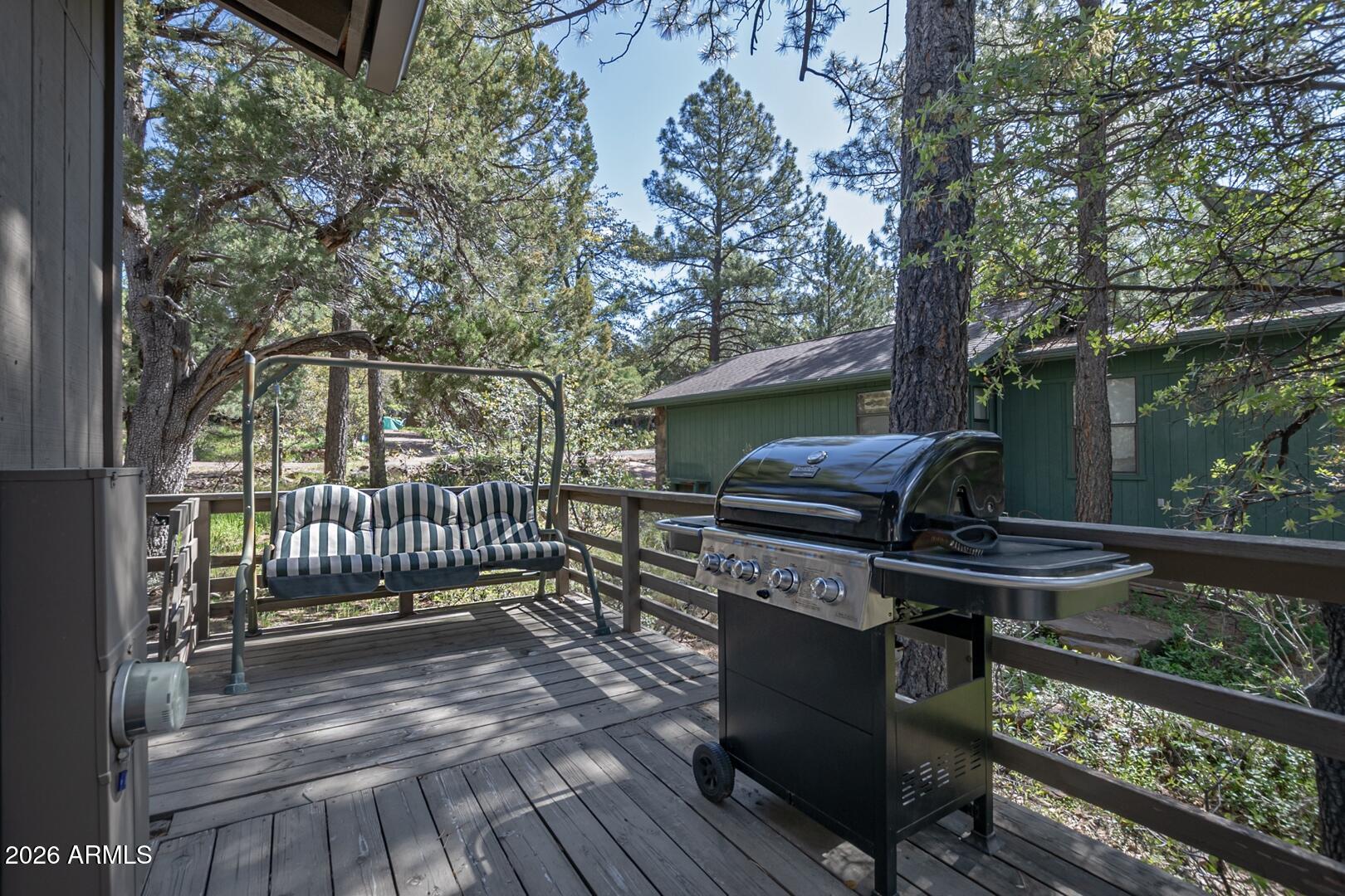 4880 Tor Street Pine, AZ 85544 - Photo 23 of 34 a view of a deck with couches and wooden floor