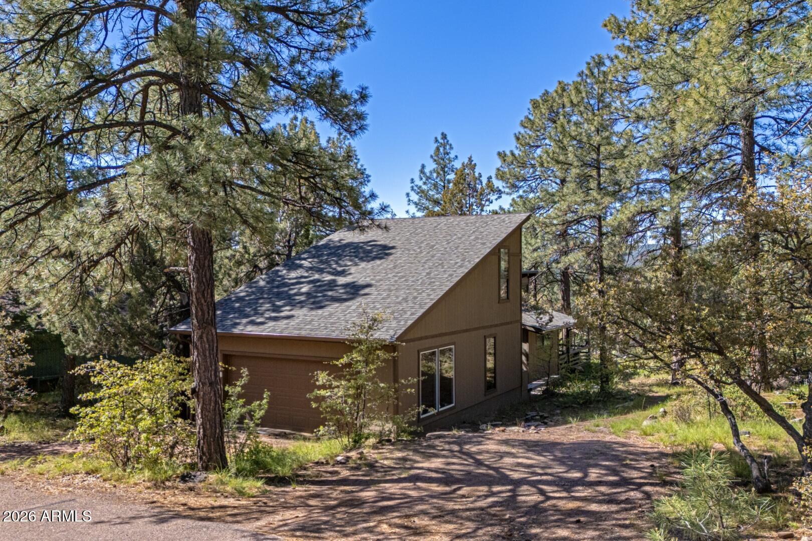 4880 Tor Street Pine, AZ 85544 - Photo 3 of 34 a view of a house with a tree
