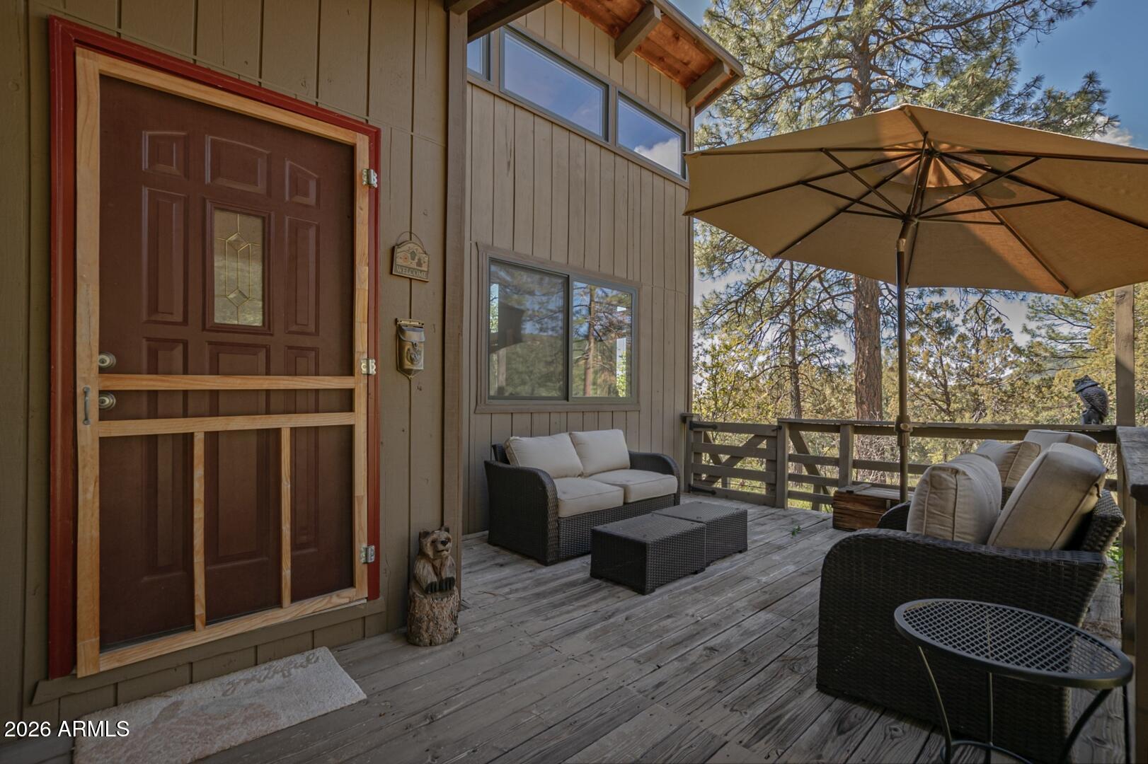 4880 Tor Street Pine, AZ 85544 - Photo 34 of 34 an outdoor space with patio the couches and a umbrella