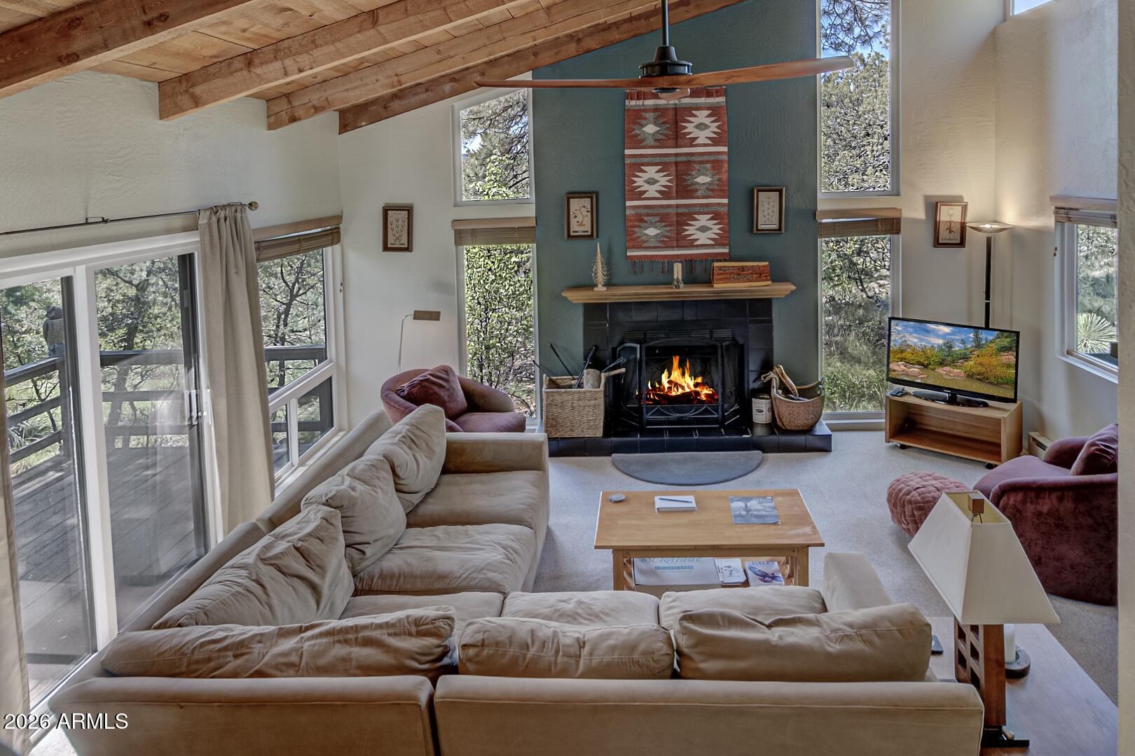 4880 Tor Street Pine, AZ 85544 - Photo 5 of 34 a living room with furniture and a fireplace