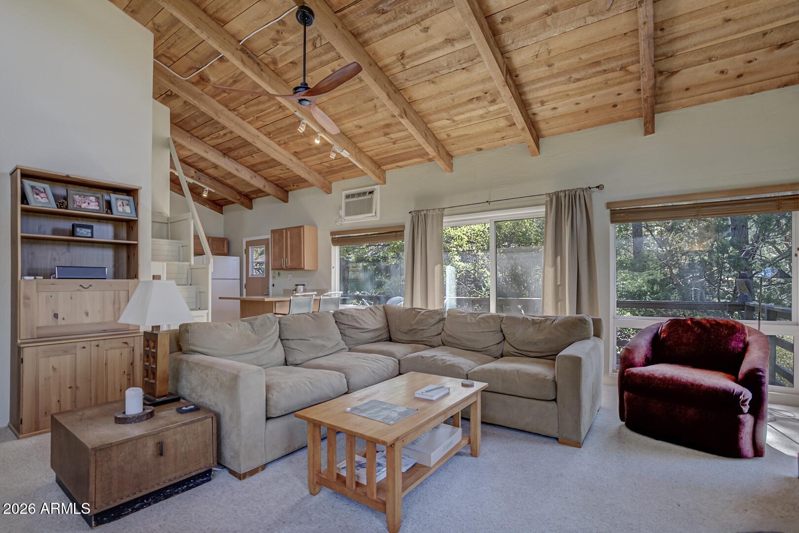 4880 Tor Street Pine, AZ 85544 - Photo 6 of 34 a living room with furniture a ceiling fan and a large window