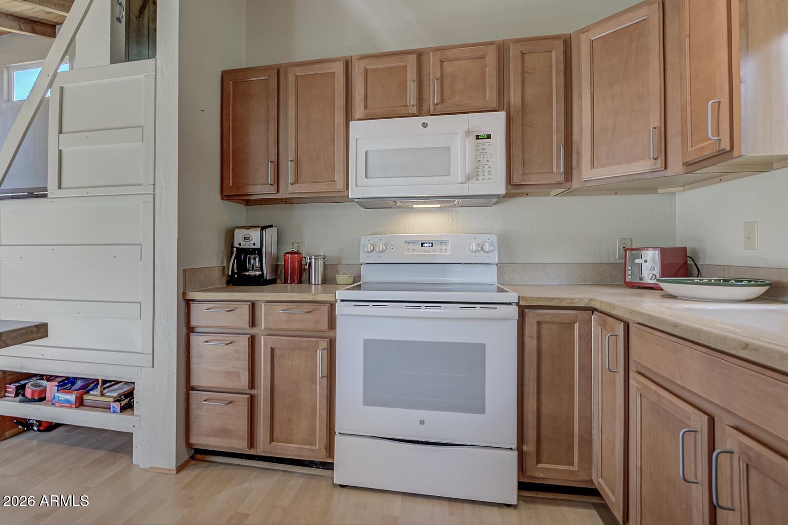 4880 Tor Street Pine, AZ 85544 - Photo 10 of 34 a kitchen with cabinets appliances and a sink