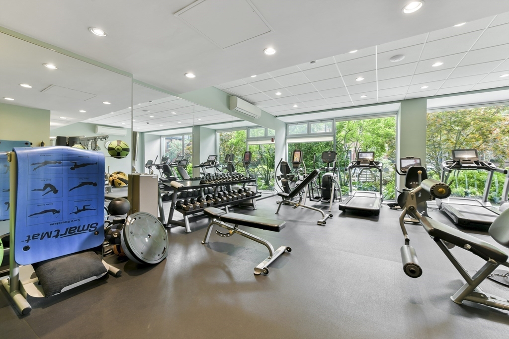 330 Beacon Street, Unit 85 Boston, MA 02116 - Photo 15 of 16 a room with gym equipment and a large window