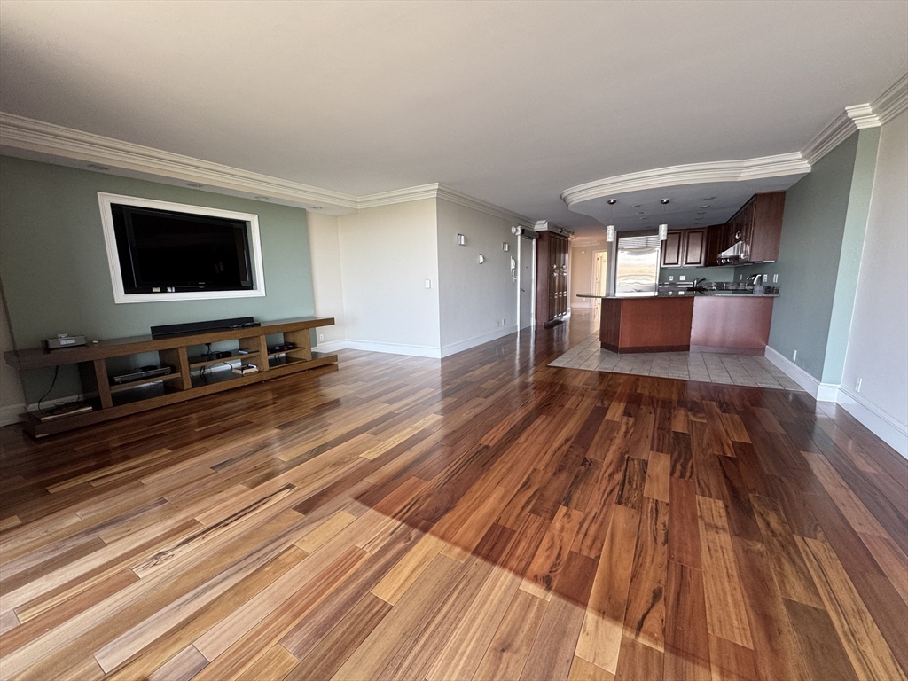 330 Beacon Street, Unit 85 Boston, MA 02116 - Photo 2 of 16 a living room with furniture and a flat screen tv