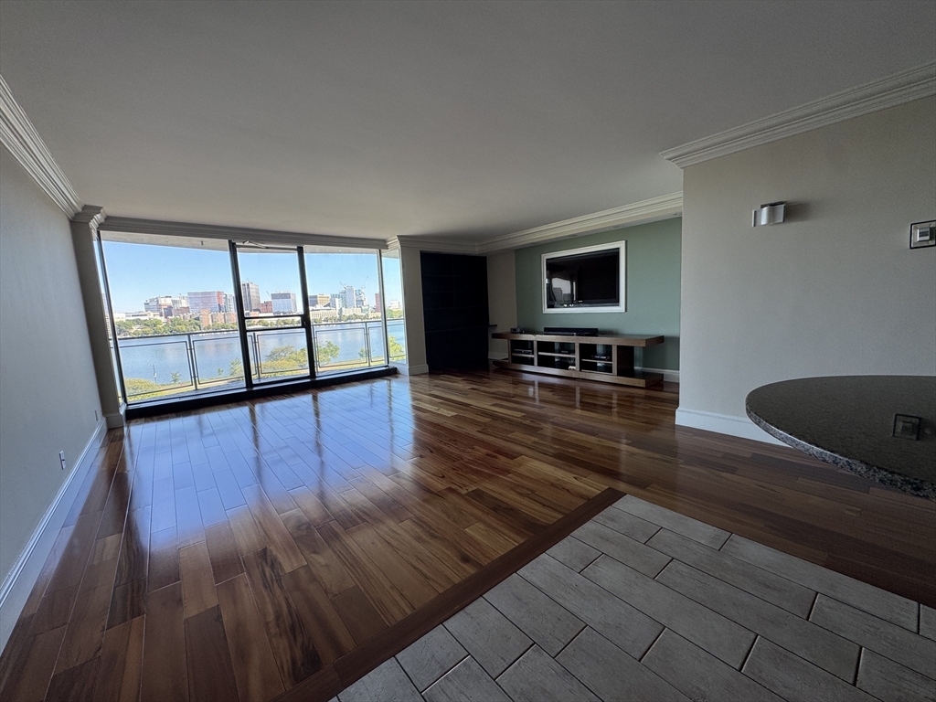 330 Beacon Street, Unit 85 Boston, MA 02116 - Photo 3 of 16 a living room with furniture and a flat screen tv