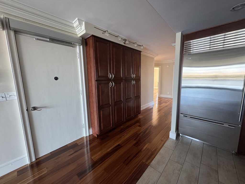 330 Beacon Street, Unit 85 Boston, MA 02116 - Photo 6 of 16 a view of hallway with wooden floor