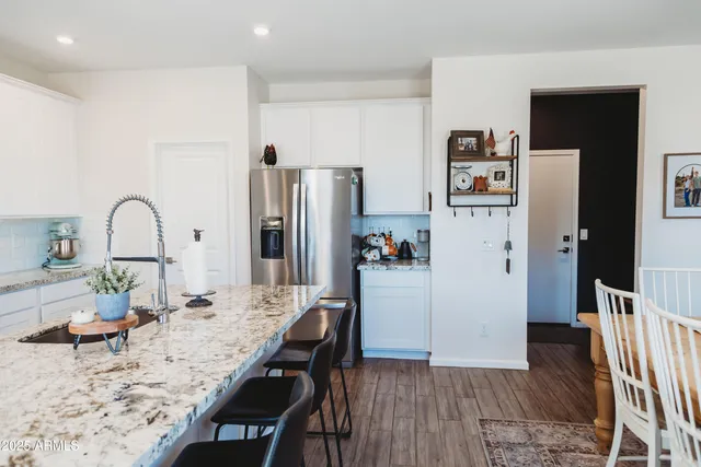a work room with furniture and a window
