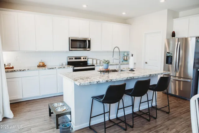 a view of bedroom with furniture and wooden floor